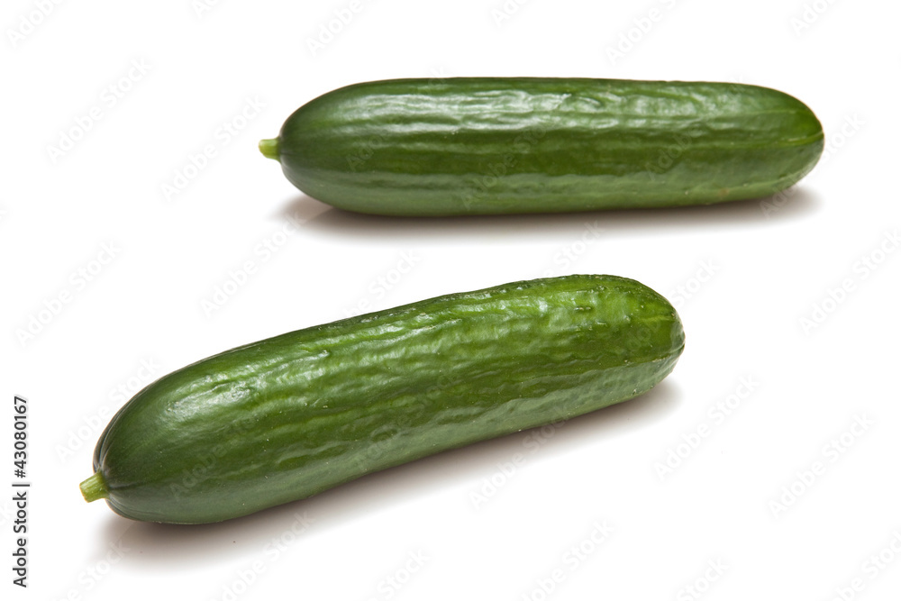 Mini Cucumbers isolated on a white studio background. Mini Cucumbers isolated on a white studio background.