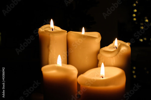 Five candles burning in the darkness