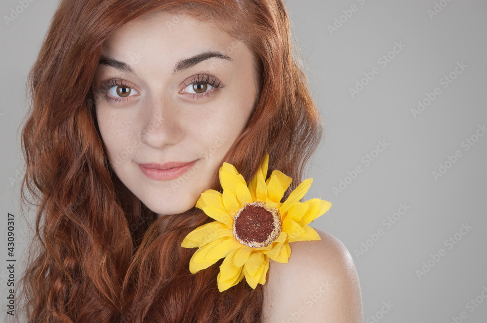 Portrait of a smiling red haired girl