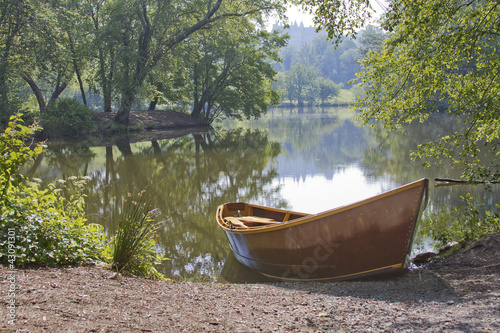 Fotografie, Obraz Rowboat By a Peaceful Lake