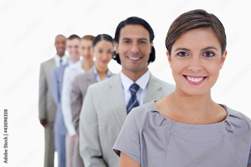 Big close-up of colleagues in a single line smiling and looking Big close-up of colleagues in a single line smiling and looking