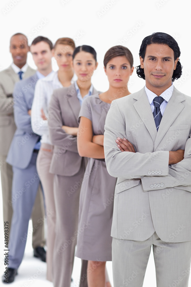 Close-up of colleagues crossing their arms in a single line Close-up of colleagues crossing their arms in a single line
