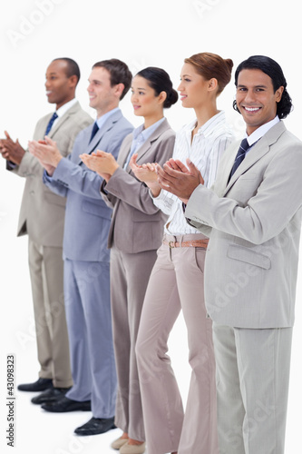 Business team smiling and applauding