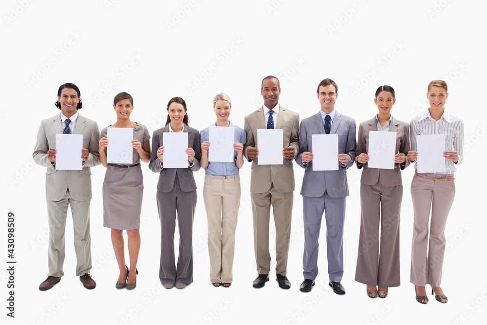 Obraz premium Business people holding white support for letters