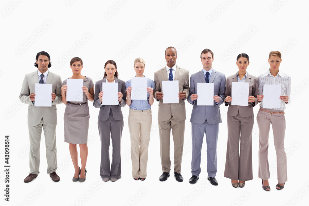 Fototapeta premium Serious business people holding support for letters
