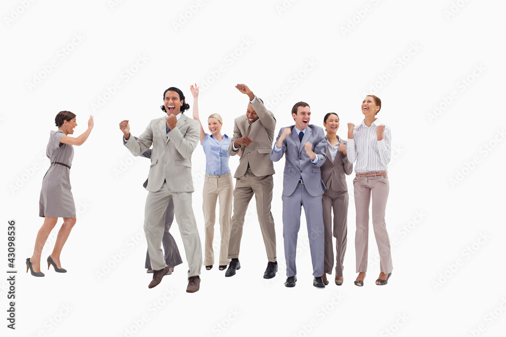 Obraz premium Very happy business people jumping and clenching their fists