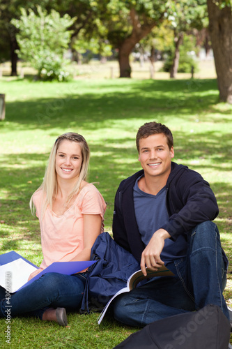 Portrait of two students in a park