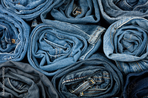 Stack of blue jeans photo