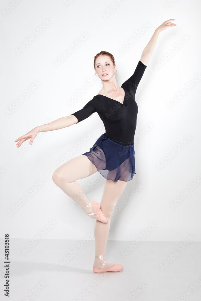 Young beautiful dancer posing on a studio Young beautiful dancer posing on a studio