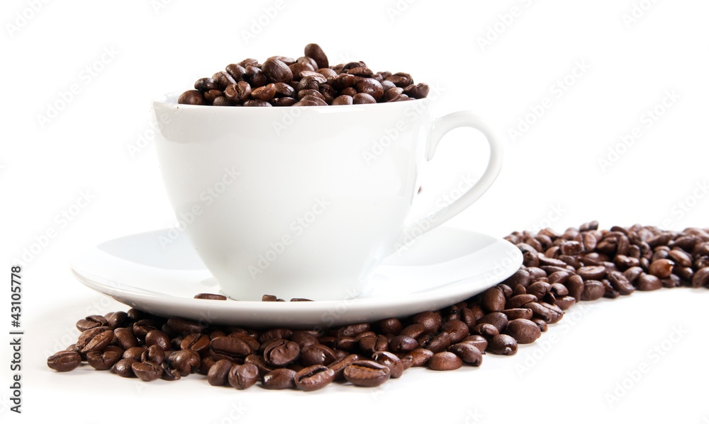 Cup full of coffee beans Cup full of coffee beans
