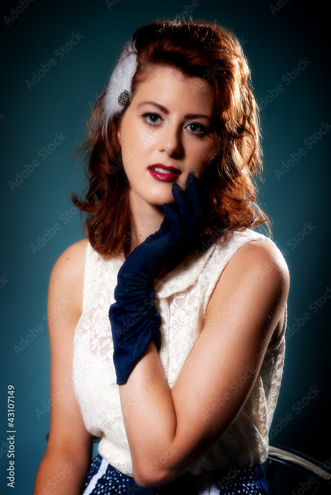 Beautiful retro young female in blue gloves and dress Beautiful retro young female in blue gloves and dress