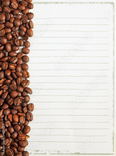 Coffee beans on white paper background for notes