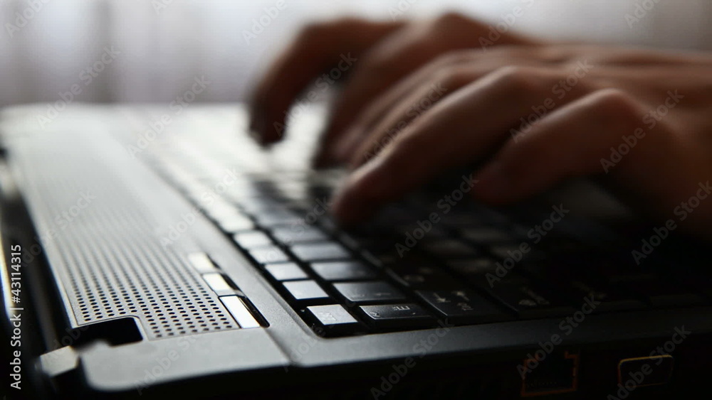 typing on a laptop keyboard typing on a laptop keyboard