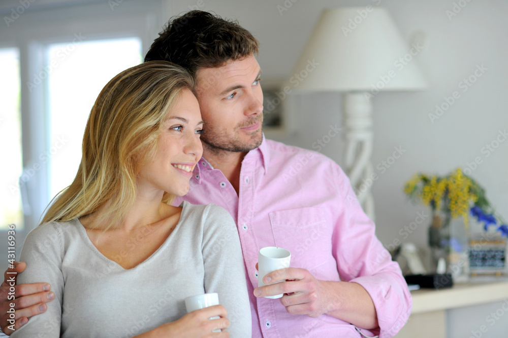 Portrait of in love couple standing at home Portrait of in love couple standing at home