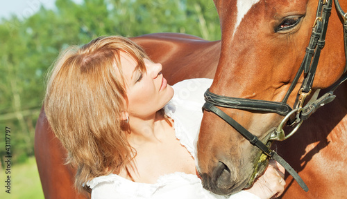 Fototapeta Naklejka Na Ścianę i Meble -  portaits of cute girl  with her horse close up
