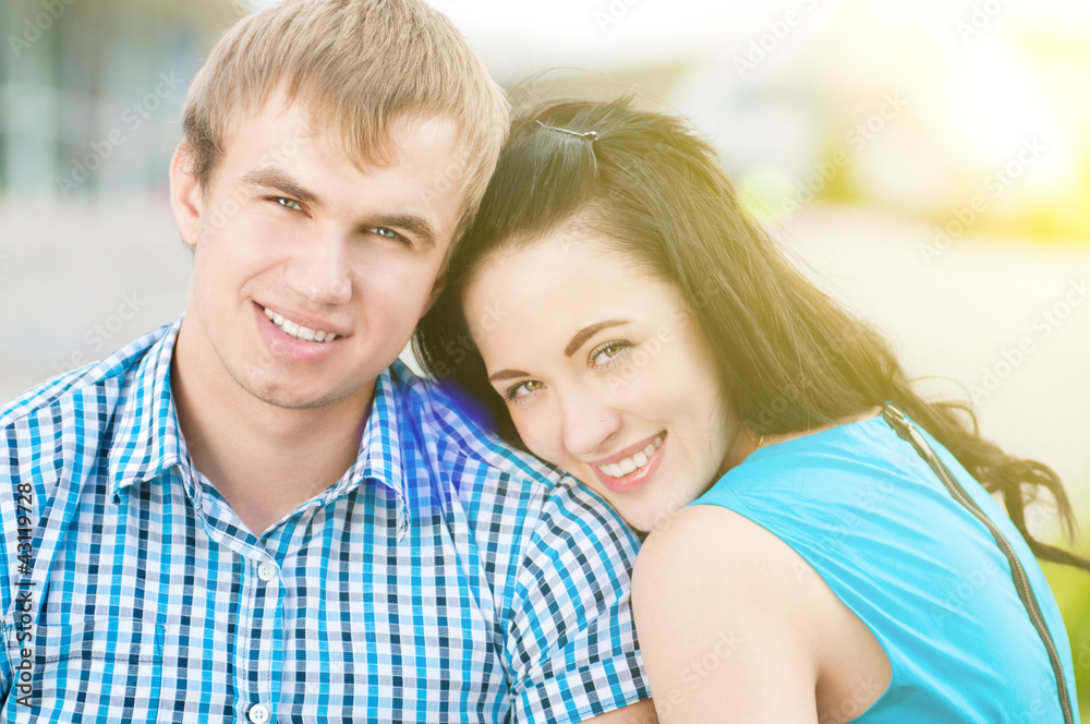 Portrait of a beautiful young happy smiling couple