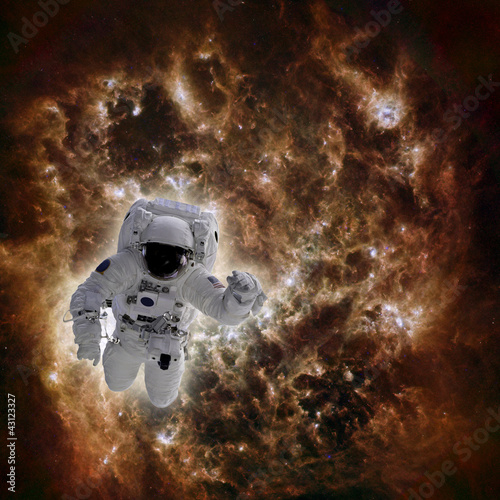 Astronaut in space with galaxy in background