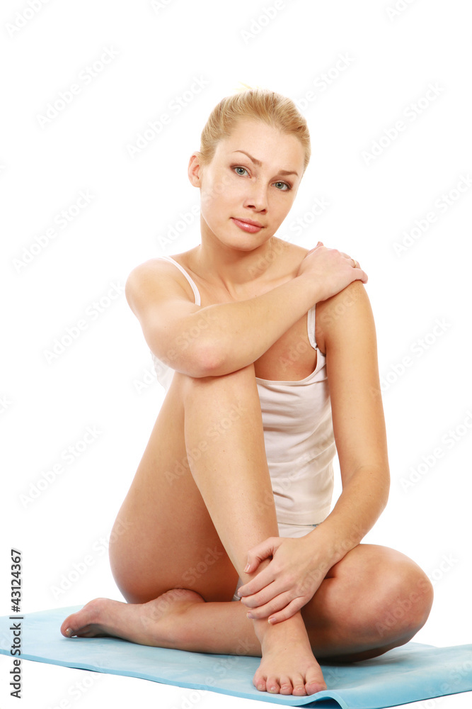 Obraz premium Young woman doing yoga