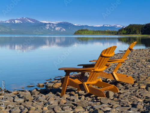 Wooden deckchairs overlooking scenic Lake Laberge photo