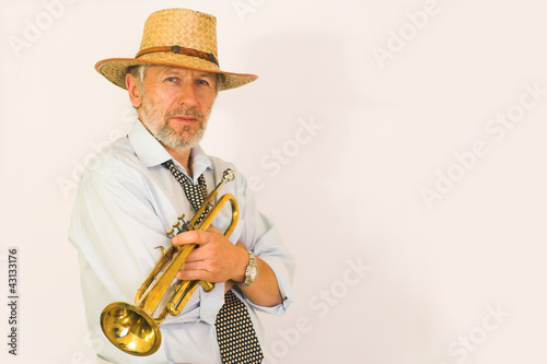 Trumpeter in a straw hut photo