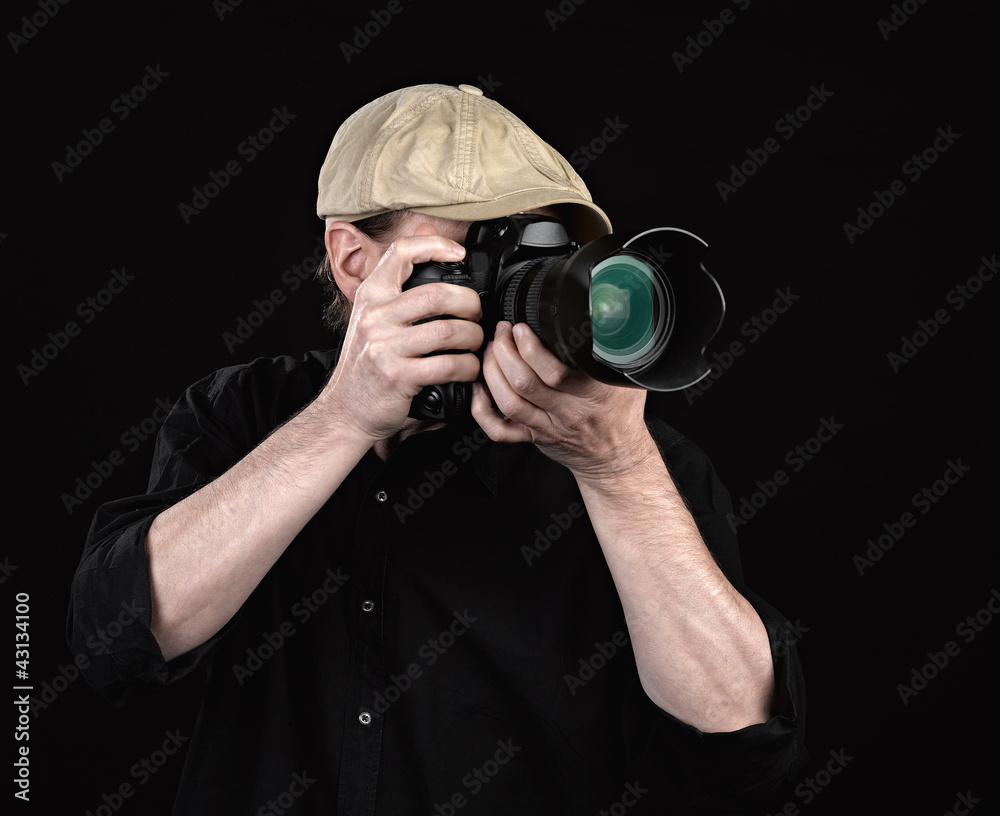 A photographer with a nice camera. A photographer with a nice camera.