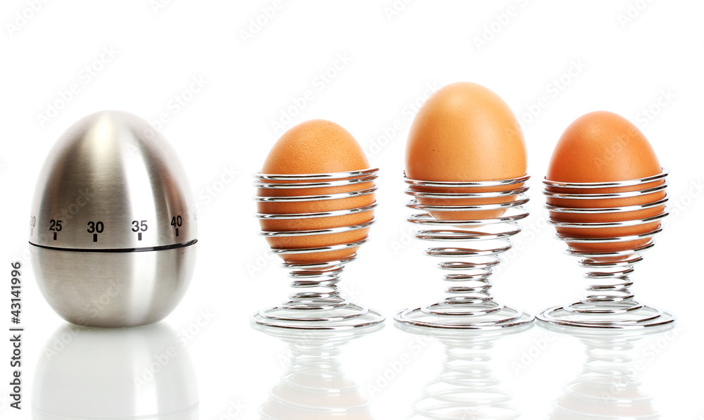 egg timer and egg in metal stand isolated on white egg timer and egg in metal stand isolated on white