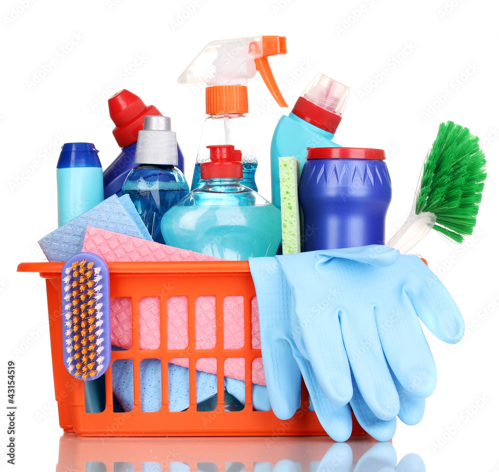 Cleaning items in plastic basket isolated on white Cleaning items in plastic basket isolated on white