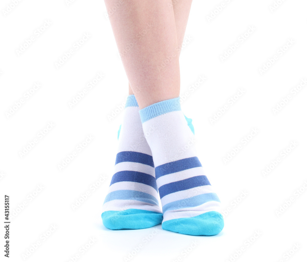 female legs in striped socks isolated on white female legs in striped socks isolated on white