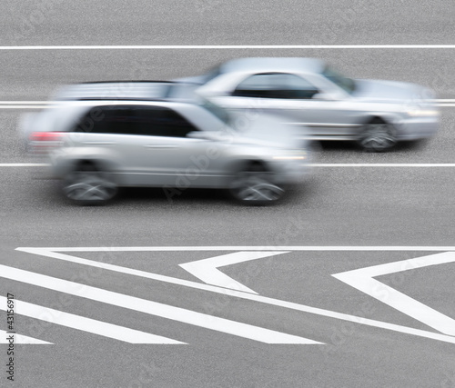 Road markings and cars. Abstract background.