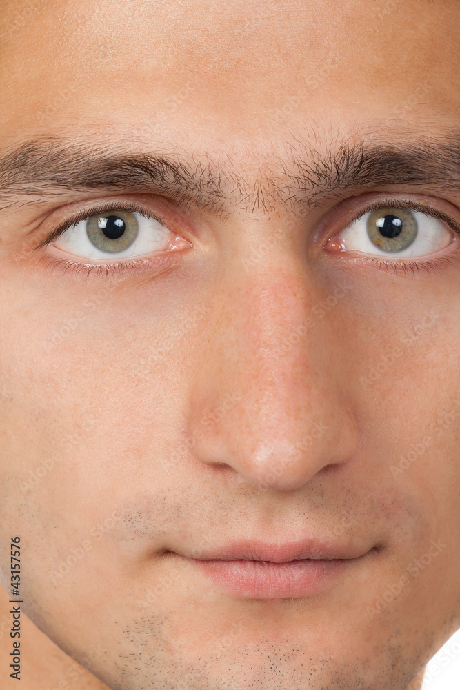 Young man's face. Close up macro portrait