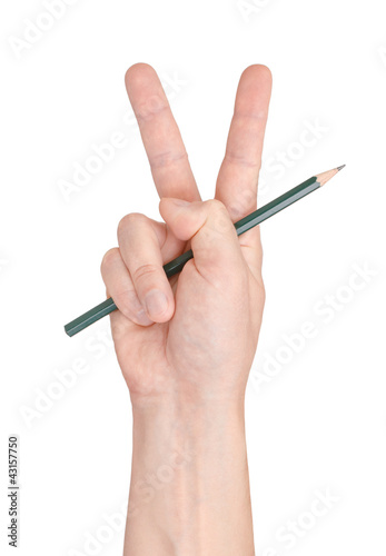 Victory and pencil. Gesture of the hand on white background.