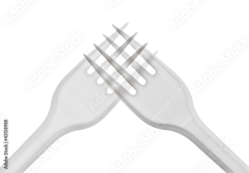 intersecting plastic forks on a white background