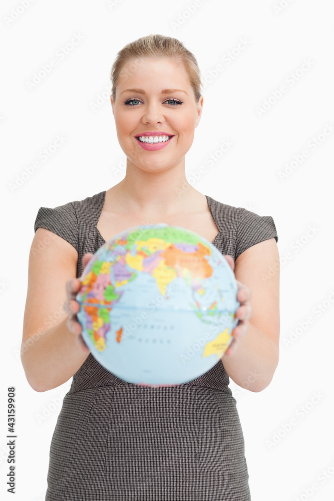 Woman showing a globe Woman showing a globe