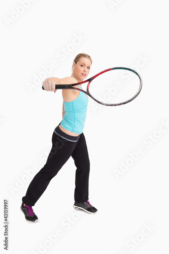 Woman playing tennis with a racket © WavebreakmediaMicro