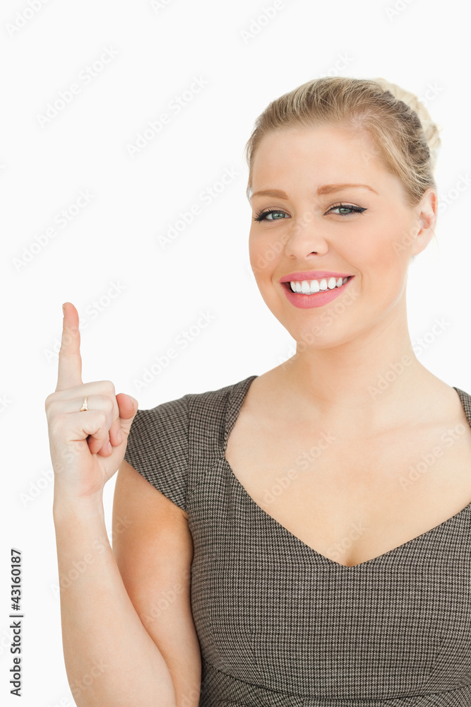 Pretty woman pointing something with her finger Pretty woman pointing something with her finger