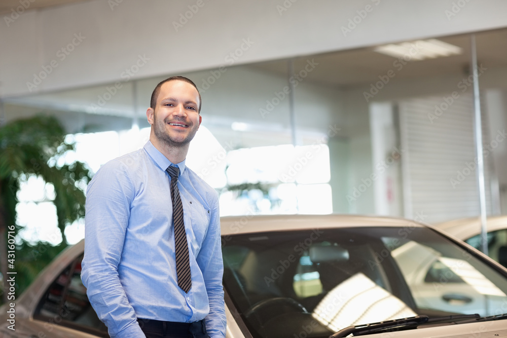 Man standing between cars Man standing between cars