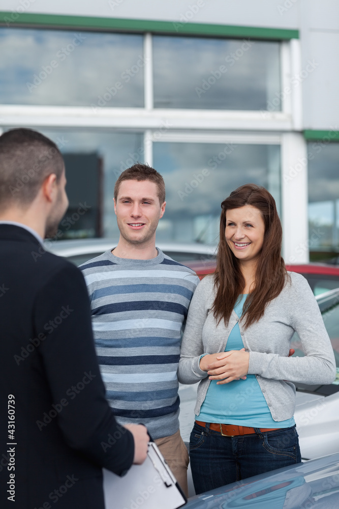 Clients talking with a dealer Clients talking with a dealer