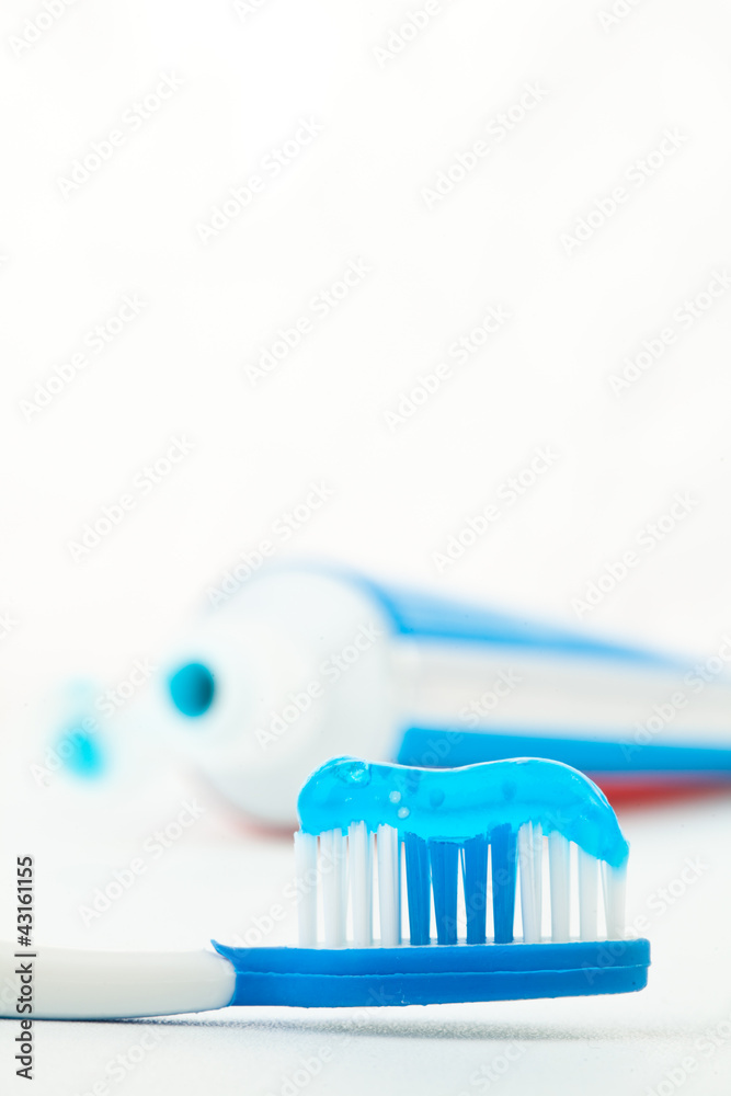 Toothpaste next to a toothbrush Toothpaste next to a toothbrush