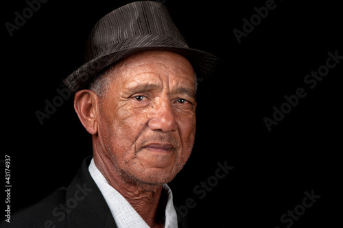Serious old man with hat