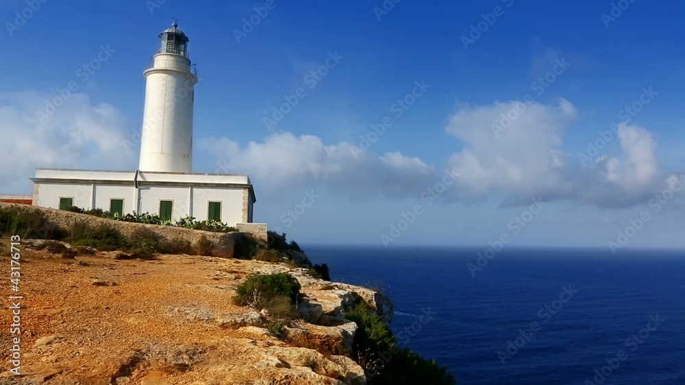 Formentera La Mola lighthouse in the blue Mediterranean sea Formentera La Mola lighthouse in the blue Mediterranean sea
