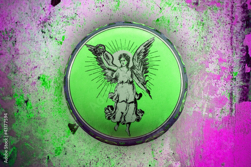 wonderful old tin can with angel motif on grunge background photo