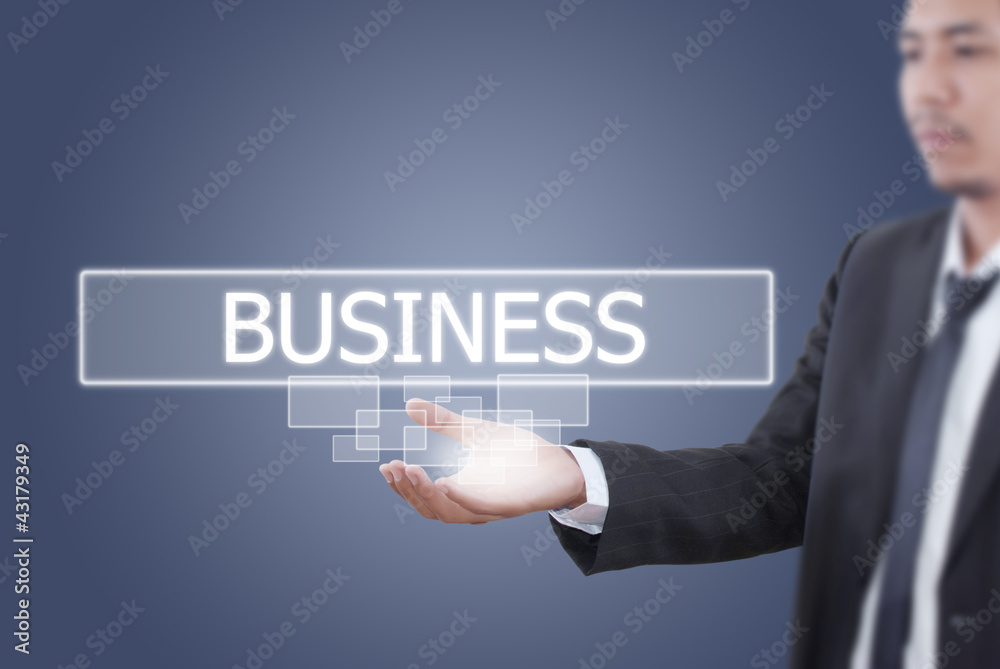 Businessman holding Business word on the whiteboard. Businessman holding Business word on the whiteboard.