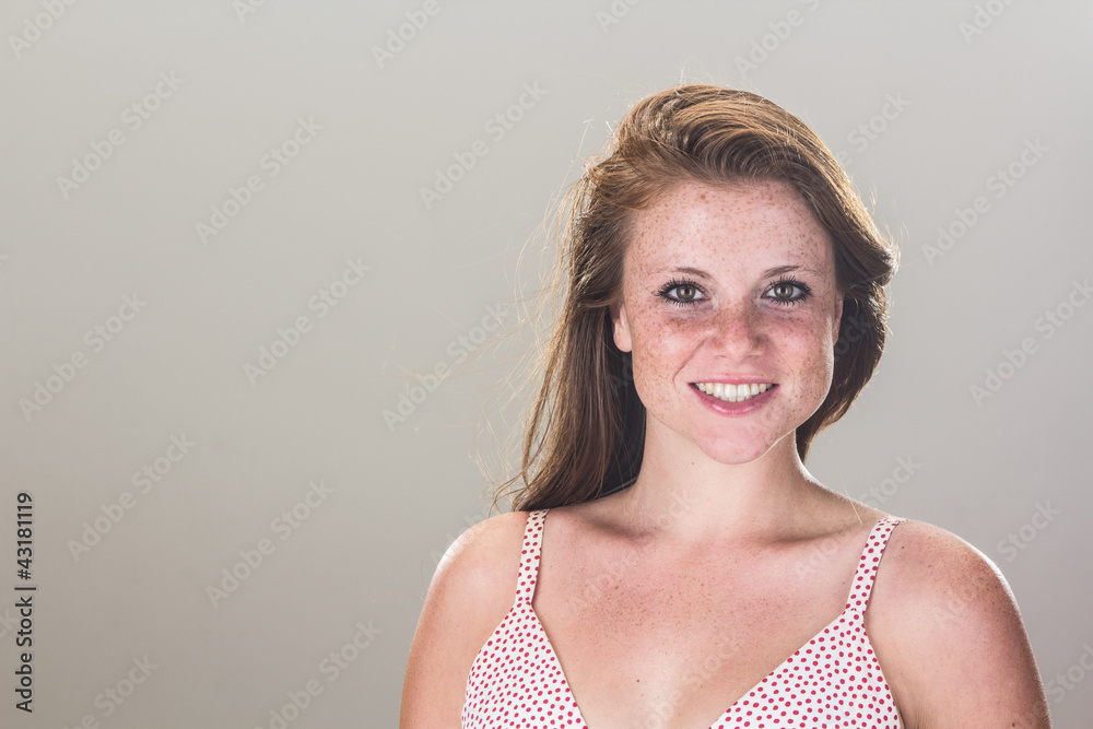 Beautiful smiling girl at home, with sensual gaze
