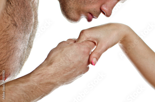 Man kissing woman's hand. Isolated on white.