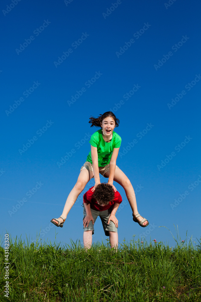Girl and boy running, jumping outdoor Girl and boy running, jumping outdoor