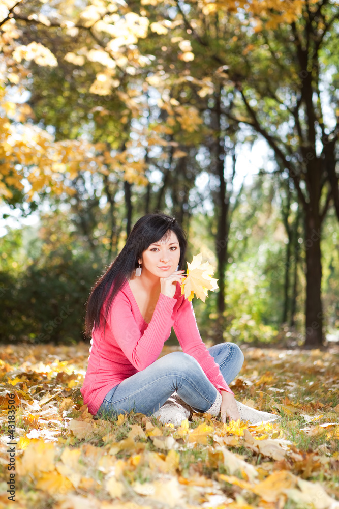 Young pretty woman rest in the autumn park Young pretty woman rest in the autumn park