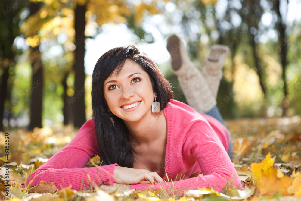Young pretty woman rest in the autumn park Young pretty woman rest in the autumn park