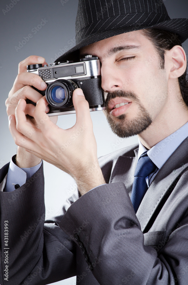 Fototapeta premium Photographer man with vintage camera