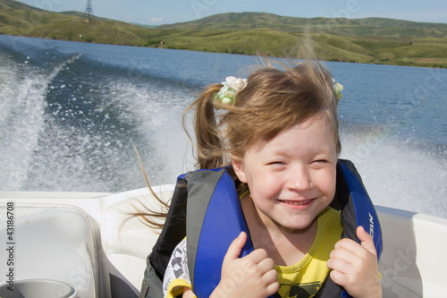 Travel of children on water in the boat