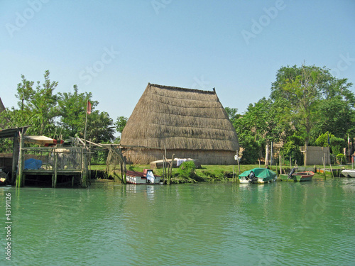 old huts and piles of straw and wood where they dwelled fisherme photo